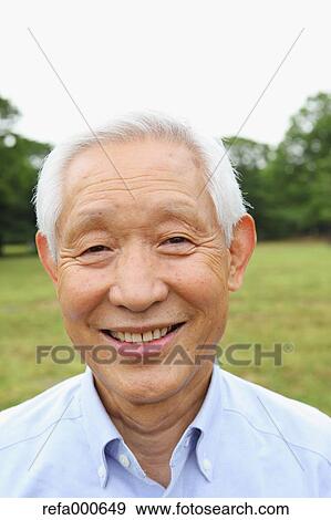 Stock Photo - Senior adult Japanese man in a park. Fotosearch
