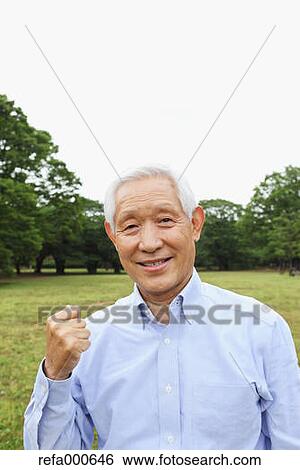 Stock Photograph - Senior adult Japanese man in a park. Fotosearch
