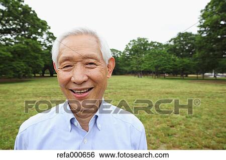Stock Photograph - Senior adult Japanese man in a park. Fotosearch