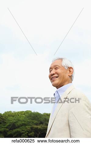 Senior adult Japanese man in a park View Large Photo Image Stock Photography - Senior adult Japanese man in a park. Fotosearch