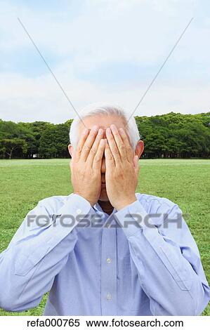 Stock Photography - Senior adult Japanese man in a park. Fotosearch