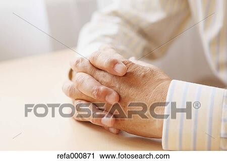 Stock Image - Senior adult Japanese man sitting. Fotosearch