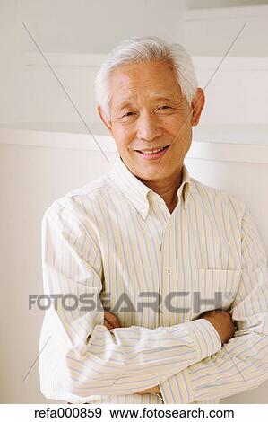Stock Photo - Senior adult Japanese man smiling. Fotosearch