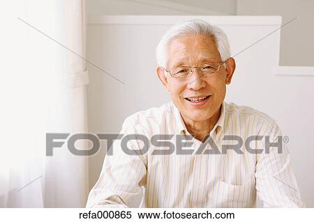 Stock Photography - Senior adult Japanese man smiling. Fotosearch