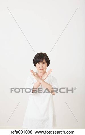 Senior adult Japanese woman against white wall View Large Photo Image Stock Photo - Senior adult Japanese woman against white wall. Fotosearch