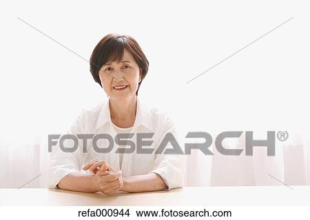 Senior adult Japanese woman by the window View Large Photo Image Picture - Senior adult Japanese woman by the window. Fotosearch