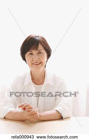 Senior adult Japanese woman by the window View Large Photo Image Stock Image - Senior adult Japanese woman by the window. Fotosearch