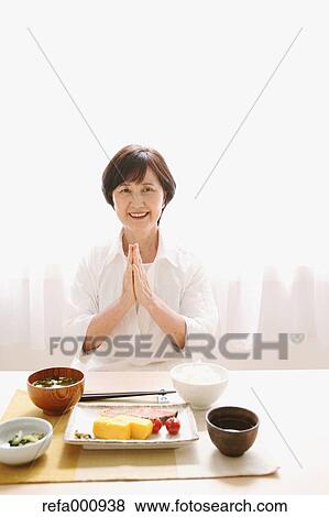 Senior adult Japanese woman eating View Large Photo Image Stock Photo - Senior adult Japanese woman eating. Fotosearch