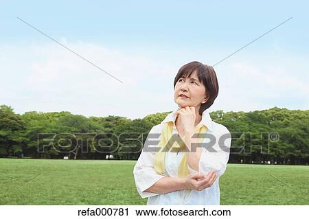 Senior adult Japanese woman in a park View Large Photo Image Stock Image - Senior adult Japanese woman in a park. Fotosearch
