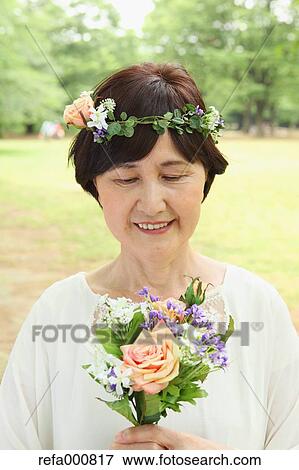 Senior adult Japanese woman in a park View Large Photo Image Stock Photo - Senior adult Japanese woman in a park. Fotosearch