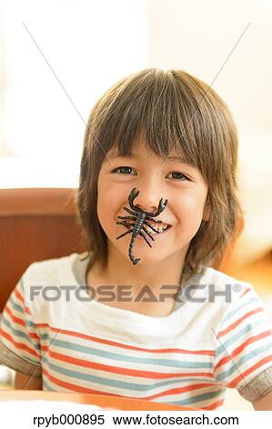 Stock Photography - Young boy playing in the house. Fotosearch