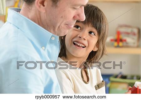 Young boy with his dad in the house View Large Photo Image Stock Photo - Young boy with his dad in the house. Fotosearch