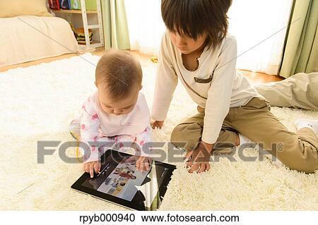 Young boys playing in the house View Large Photo Image Stock Image - Young boys playing in the house. Fotosearch