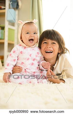 Young boys playing in the house View Large Photo Image Stock Image - Young boys playing in the house. Fotosearch