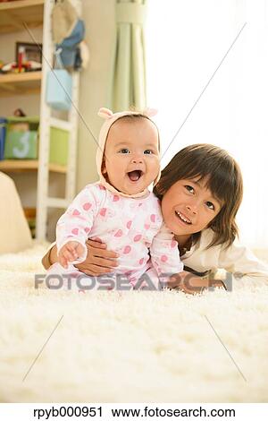 Young boys playing in the house View Large Photo Image Stock Image - Young boys playing in the house. Fotosearch