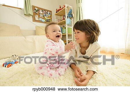 Young boys playing in the house View Large Photo Image Stock Photo - Young boys playing in the house. Fotosearch
