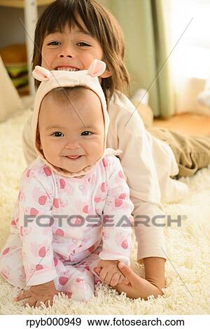 Young boys playing in the house View Large Photo Image Stock Photo - Young boys playing in the house. Fotosearch