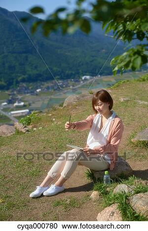 Young Japanese girl in the countryside View Large Photo Image Stock Image - Young Japanese girl in the countryside. Fotosearch