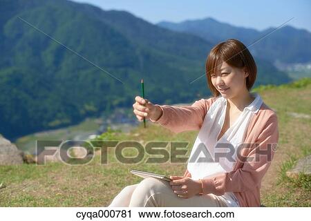 Young Japanese girl in the countryside View Large Photo Image Stock Image - Young Japanese girl in the countryside. Fotosearch