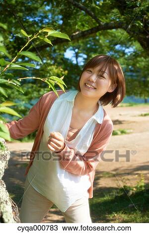 Young Japanese girl in the countryside View Large Photo Image Stock Image - Young Japanese girl in the countryside. Fotosearch