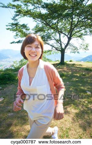 Young Japanese girl in the countryside View Large Photo Image Stock Photo - Young Japanese girl in the countryside. Fotosearch