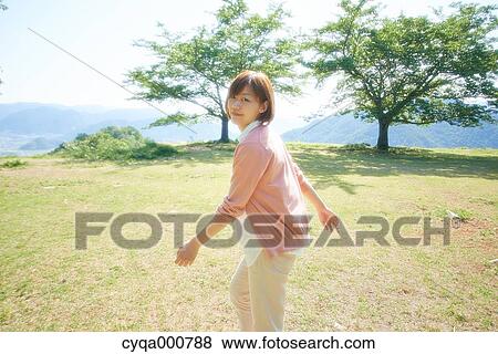 Stock Photo - Young Japanese girl in the countryside. Fotosearch