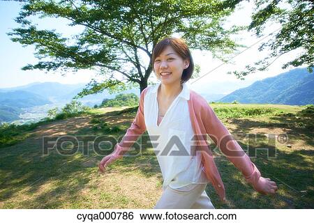Young Japanese girl in the countryside View Large Photo Image Stock Photograph - Young Japanese girl in the countryside. Fotosearch