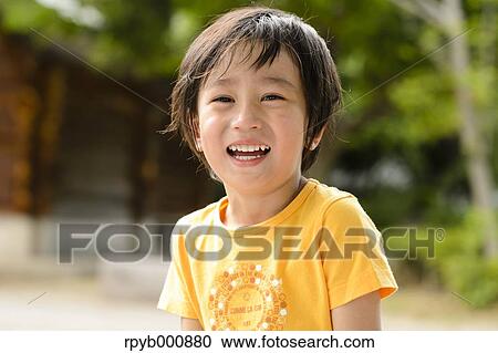 Young Japanese kid in a park View Large Photo Image Stock Image - Young Japanese kid in a park. Fotosearch