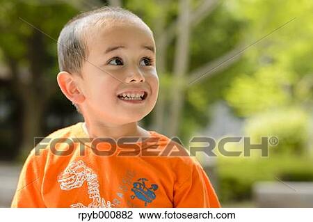 Young Japanese kid in a park View Large Photo Image Stock Image - Young Japanese kid in a park. Fotosearch
