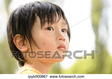 Young Japanese kid in a park View Large Photo Image Stock Photo - Young Japanese kid in a park. Fotosearch