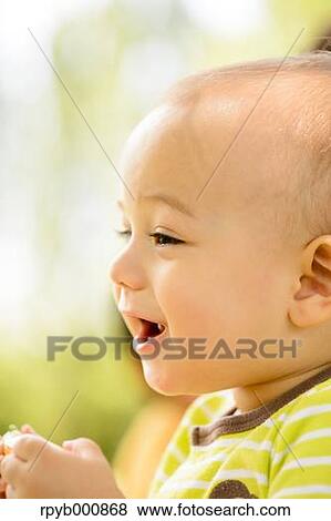 Young Japanese kid in a park View Large Photo Image Stock Photo - Young Japanese kid in a park. Fotosearch