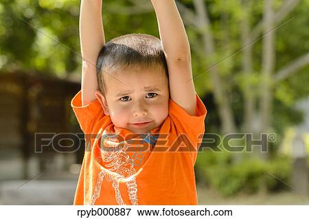 Young Japanese kid in a park View Large Photo Image Stock Photo - Young Japanese kid in a park. Fotosearch