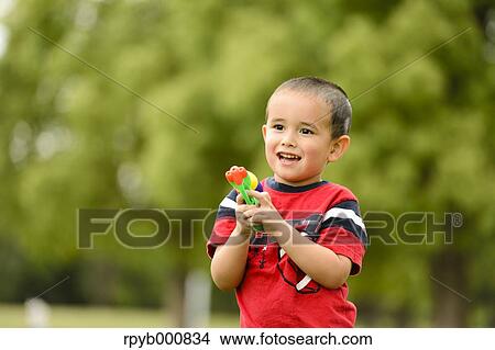 Young Japanese kid playing in a park View Large Photo Image Picture - Young Japanese kid playing in a park. Fotosearch