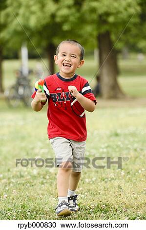 Young Japanese kid playing in a park View Large Photo Image Stock Image - Young Japanese kid playing in a park. Fotosearch
