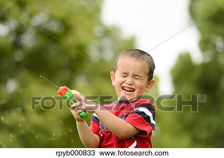 Young Japanese kid playing in a park View Large Photo Image Stock Image - Young Japanese kid playing in a park. Fotosearch