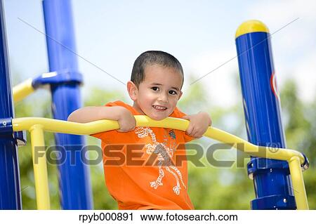 Young Japanese kid playing in a park View Large Photo Image Stock Image - Young Japanese kid playing in a park. Fotosearch