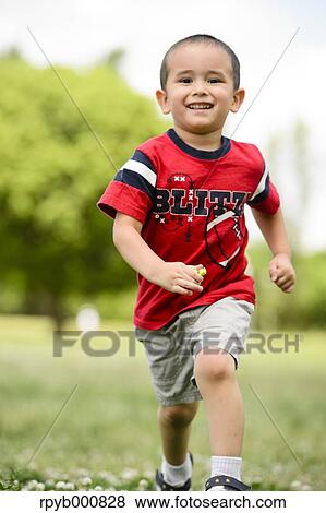 Young Japanese kid playing in a park View Large Photo Image Stock Photo - Young Japanese kid playing in a park. Fotosearch