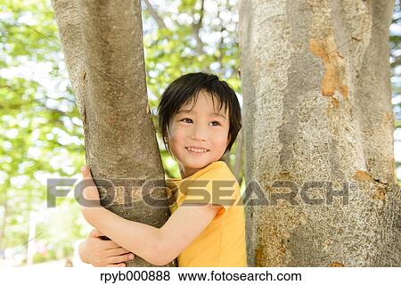 Young Japanese kid playing in a park View Large Photo Image Stock Photo - Young Japanese kid playing in a park. Fotosearch