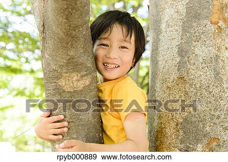 Stock Photo - Young Japanese kid playing in a park. Fotosearch