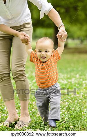 Young Japanese kid with his mum in a park View Large Photo Image Stock Image - Young Japanese kid with his mum in a park. Fotosearch