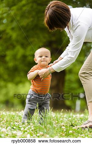 Young Japanese kid with his mum in a park View Large Photo Image Stock Photo - Young Japanese kid with his mum in a park. Fotosearch