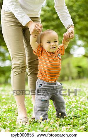Young Japanese kid with his mum in a park View Large Photo Image Stock Photography - Young Japanese kid with his mum in a park. Fotosearch