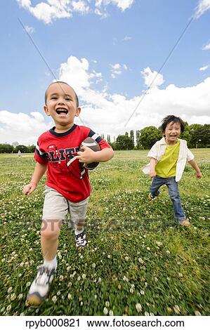 Young Japanese kids playing in a park View Large Photo Image Stock Image - Young Japanese kids playing in a park. Fotosearch
