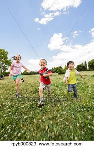 Young Japanese kids playing in a park View Large Photo Image Stock Image - Young Japanese kids playing in a park. Fotosearch