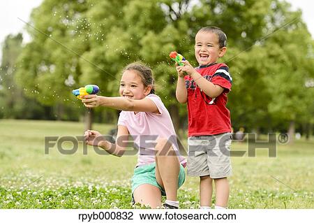 Young Japanese kids playing in a park View Large Photo Image Stock Image - Young Japanese kids playing in a park. Fotosearch