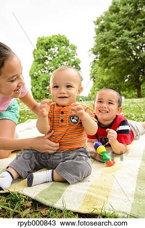 Young Japanese kids playing in a park View Large Photo Image Stock Image - Young Japanese kids playing in a park. Fotosearch