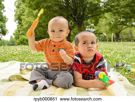 Young Japanese kids playing in a park View Large Photo Image Stock Image - Young Japanese kids playing in a park. Fotosearch