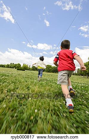 Stock Photo - Young Japanese kids playing in a park. Fotosearch