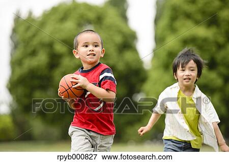 Young Japanese kids playing in a park View Large Photo Image Stock Photo - Young Japanese kids playing in a park. Fotosearch