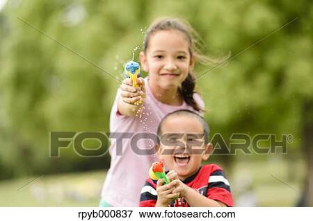 Young Japanese kids playing in a park View Large Photo Image Stock Photo - Young Japanese kids playing in a park. Fotosearch